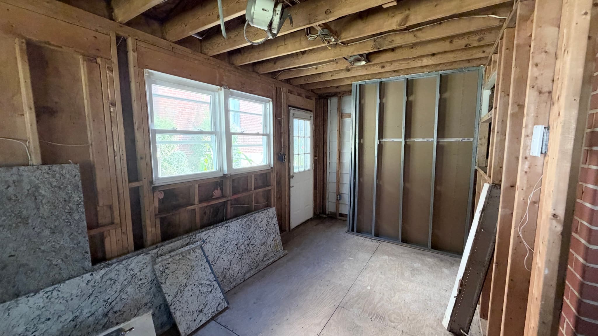 Kitchen addition — exterior door and metal-stud wall