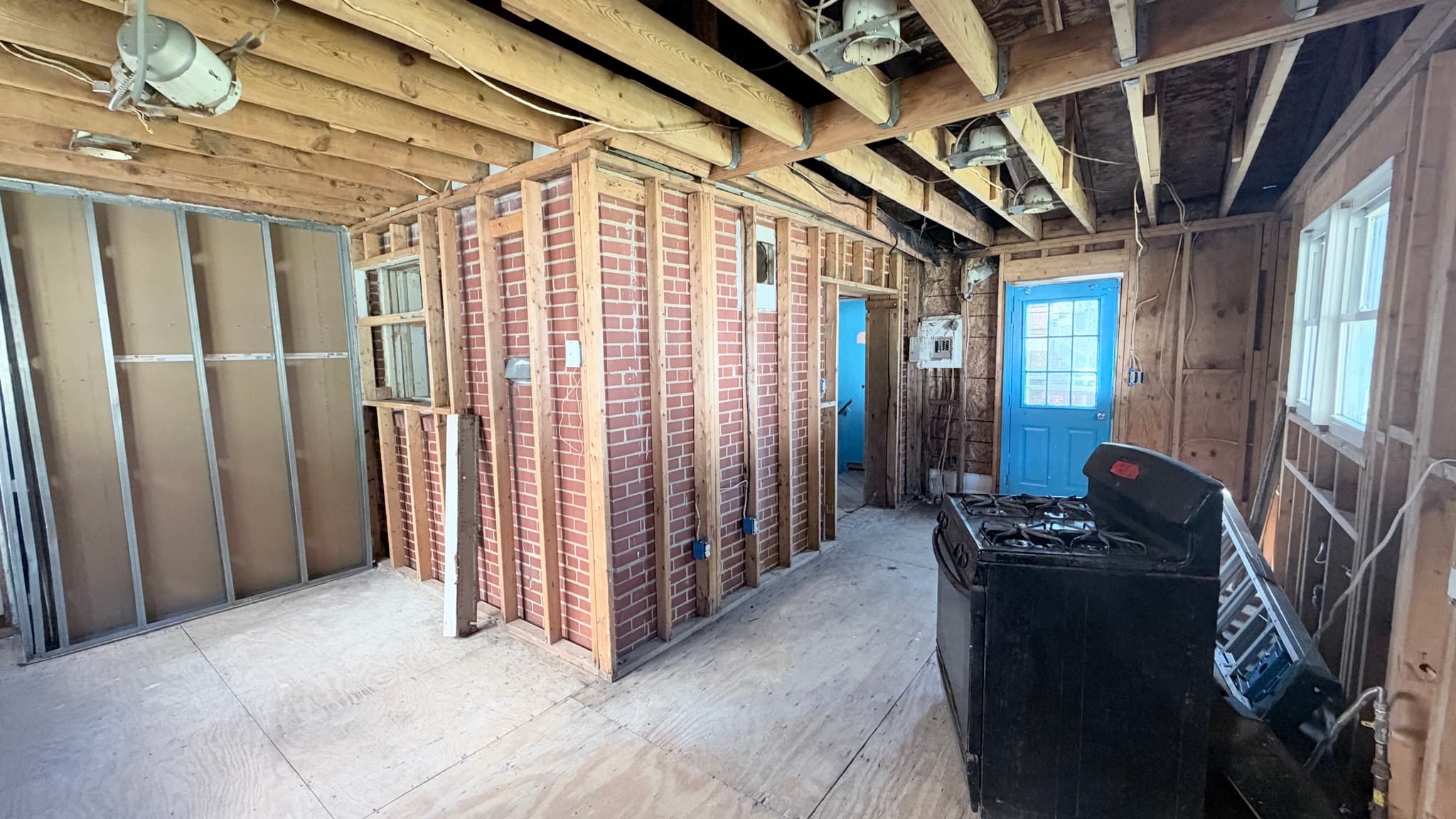 Kitchen addition along the original brick exterior wall, rear door at the end