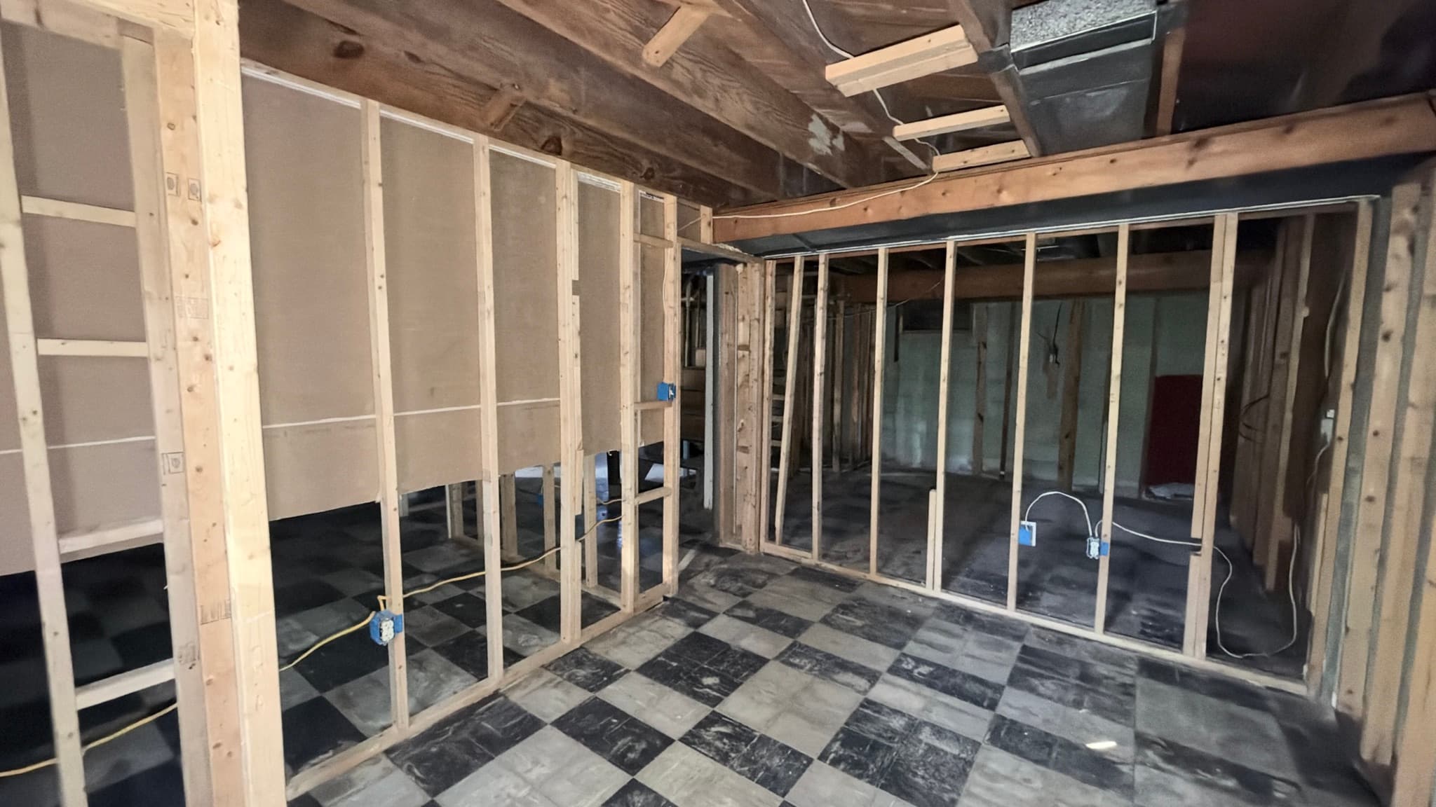 Lower level — bedroom partitions framed
