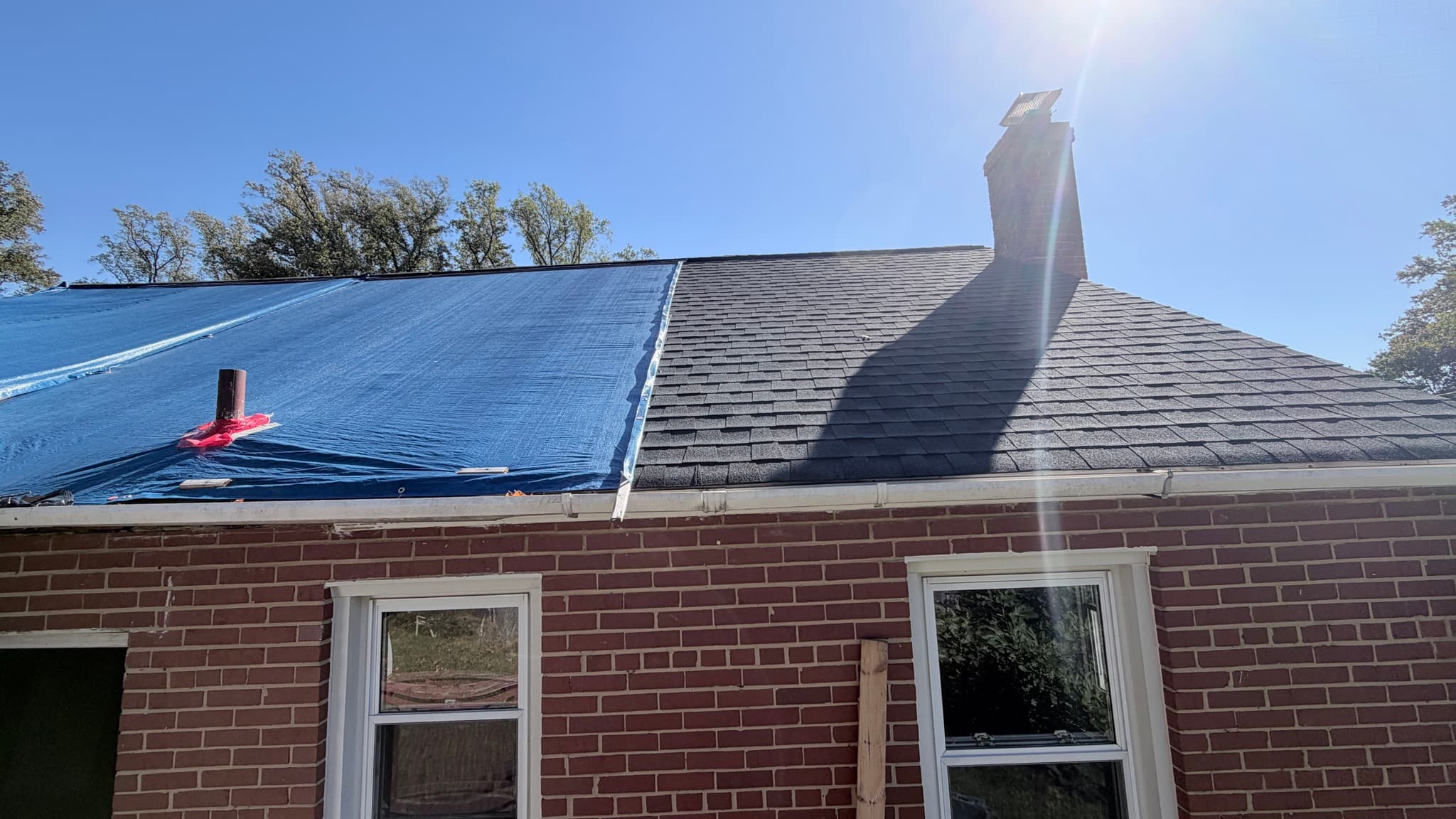 Rear roof slope, partly tarped
