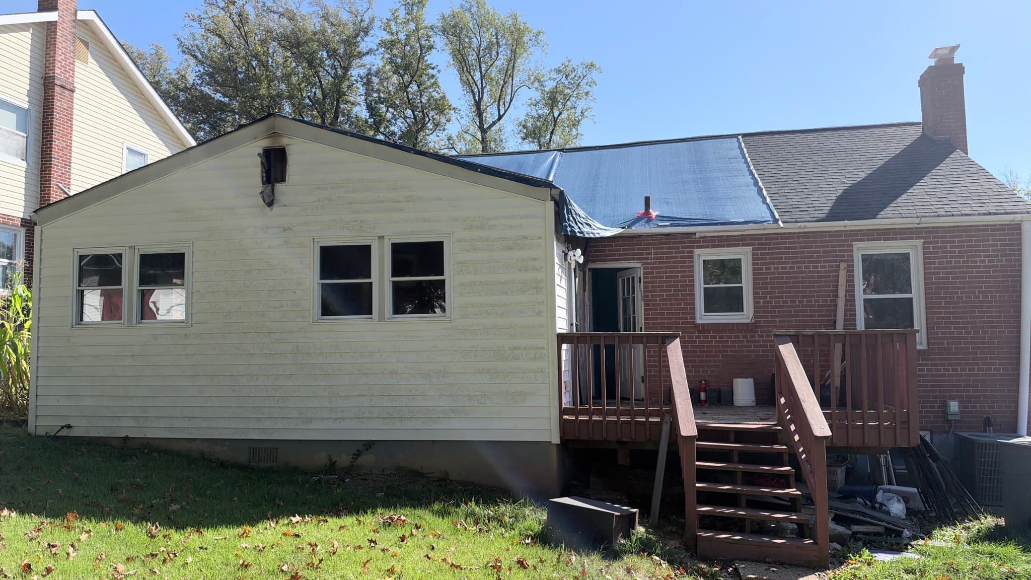 Rear of the house — kitchen addition, deck and brick main house