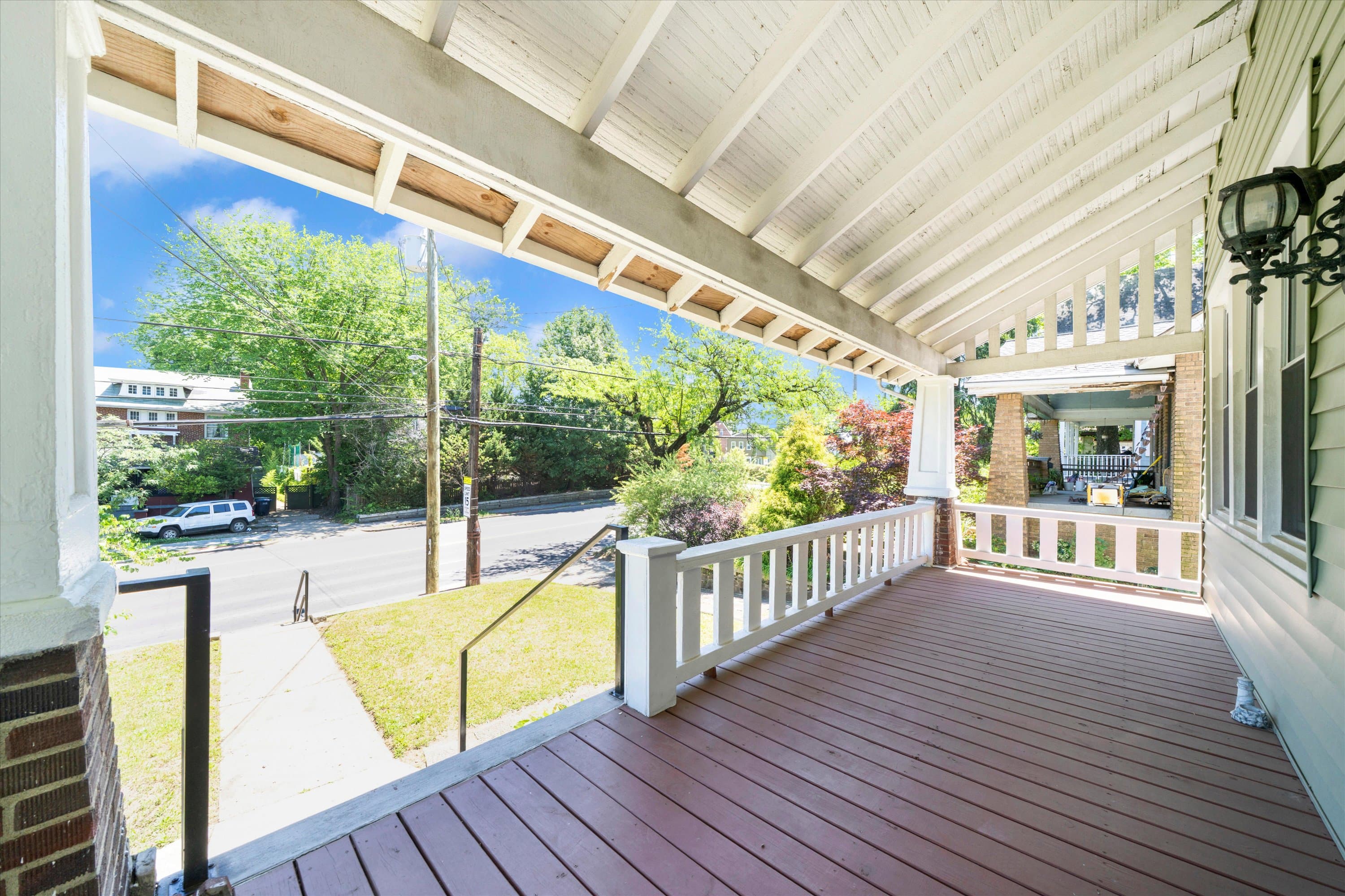 Front exterior detail at 3034 South Dakota Ave NE showing porch and Craftsman trim