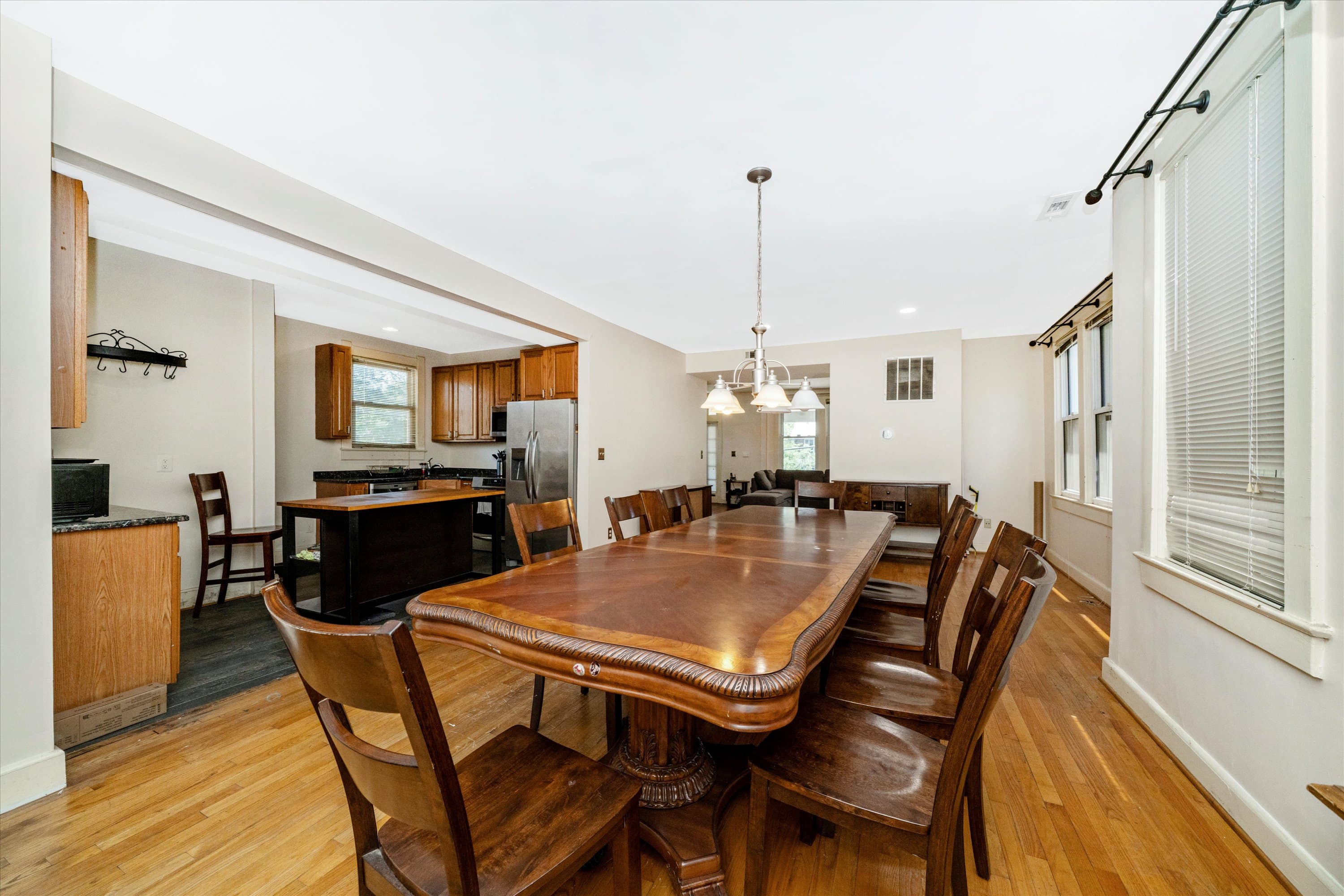 Dining area with table seating and hardwood floors at 3034 South Dakota Ave NE