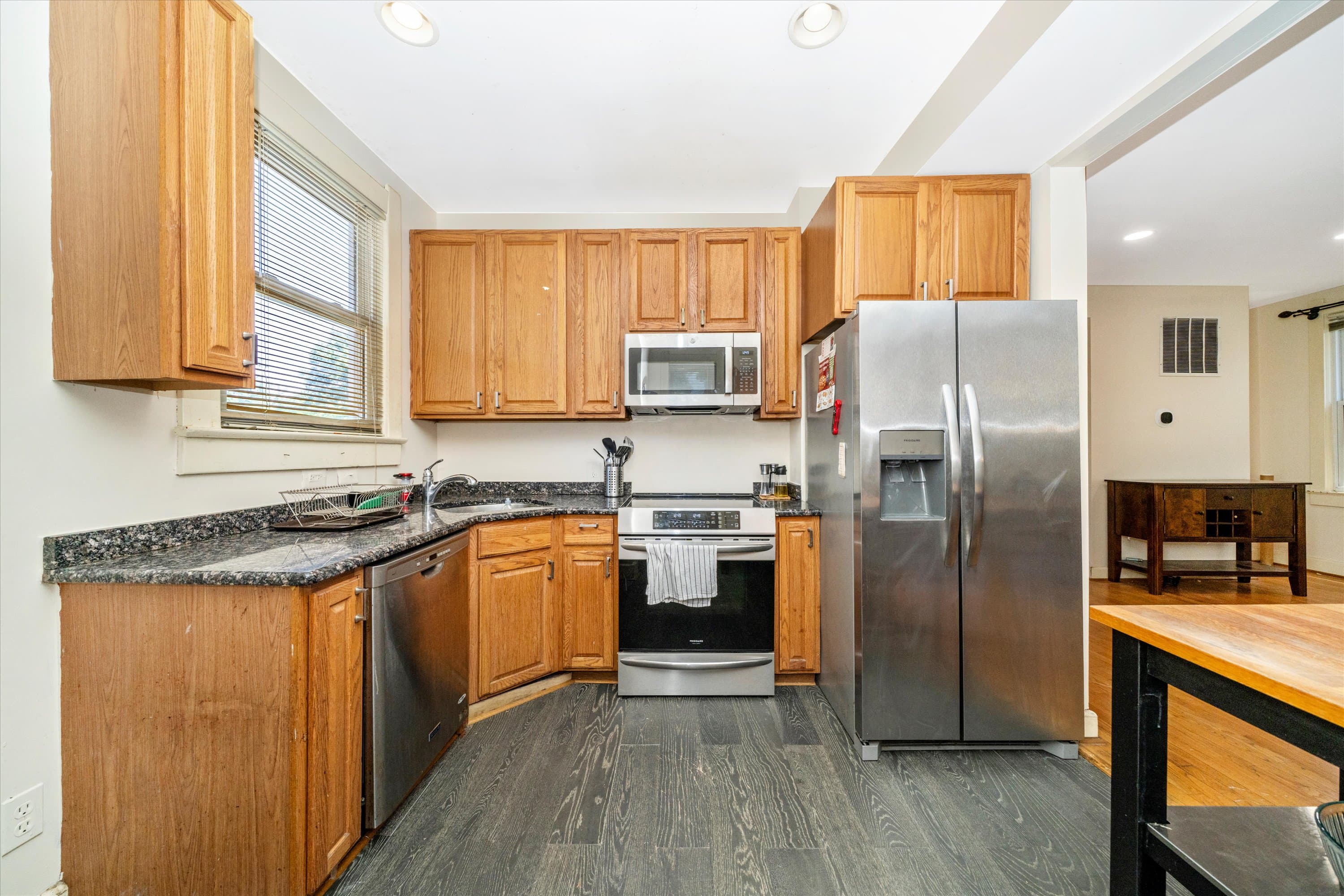 Kitchen working angle with stainless range and recessed lighting at 3034 South Dakota Ave NE