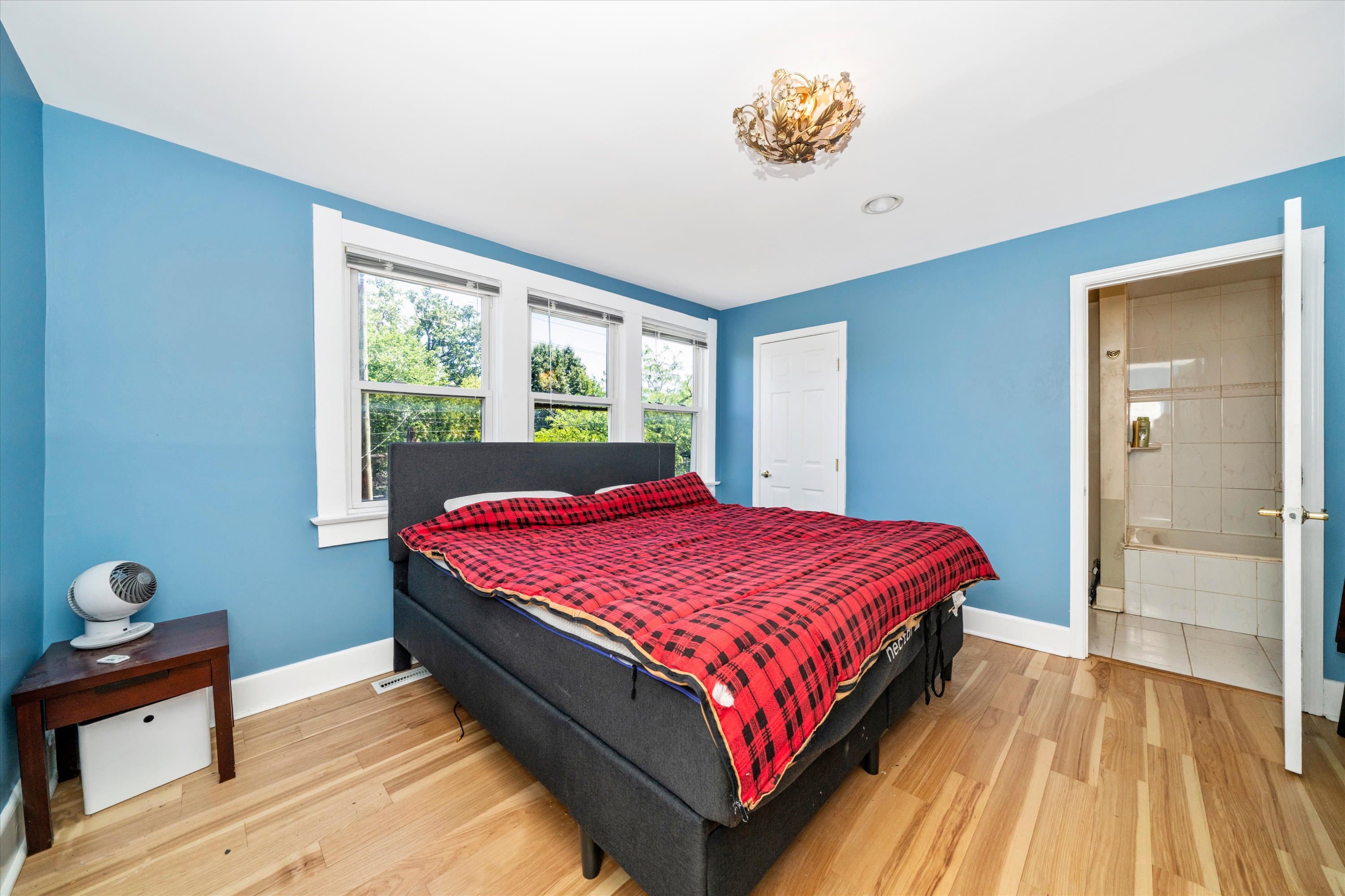 Primary bedroom with hardwood floors and natural light at 3034 South Dakota Ave NE