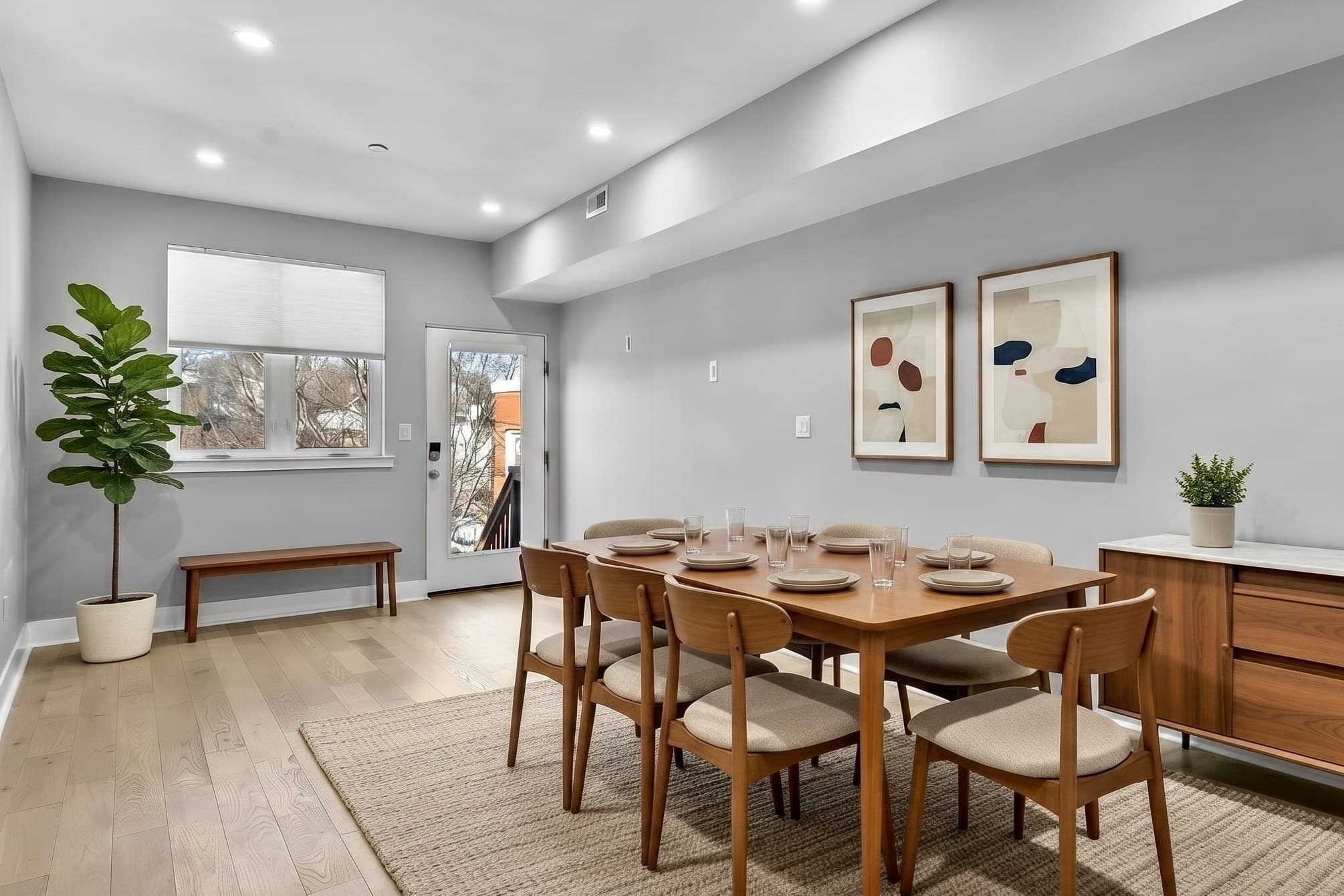 Dining area with direct rear access to the patio and parking, virtually staged, at 3572 13th St NW #2