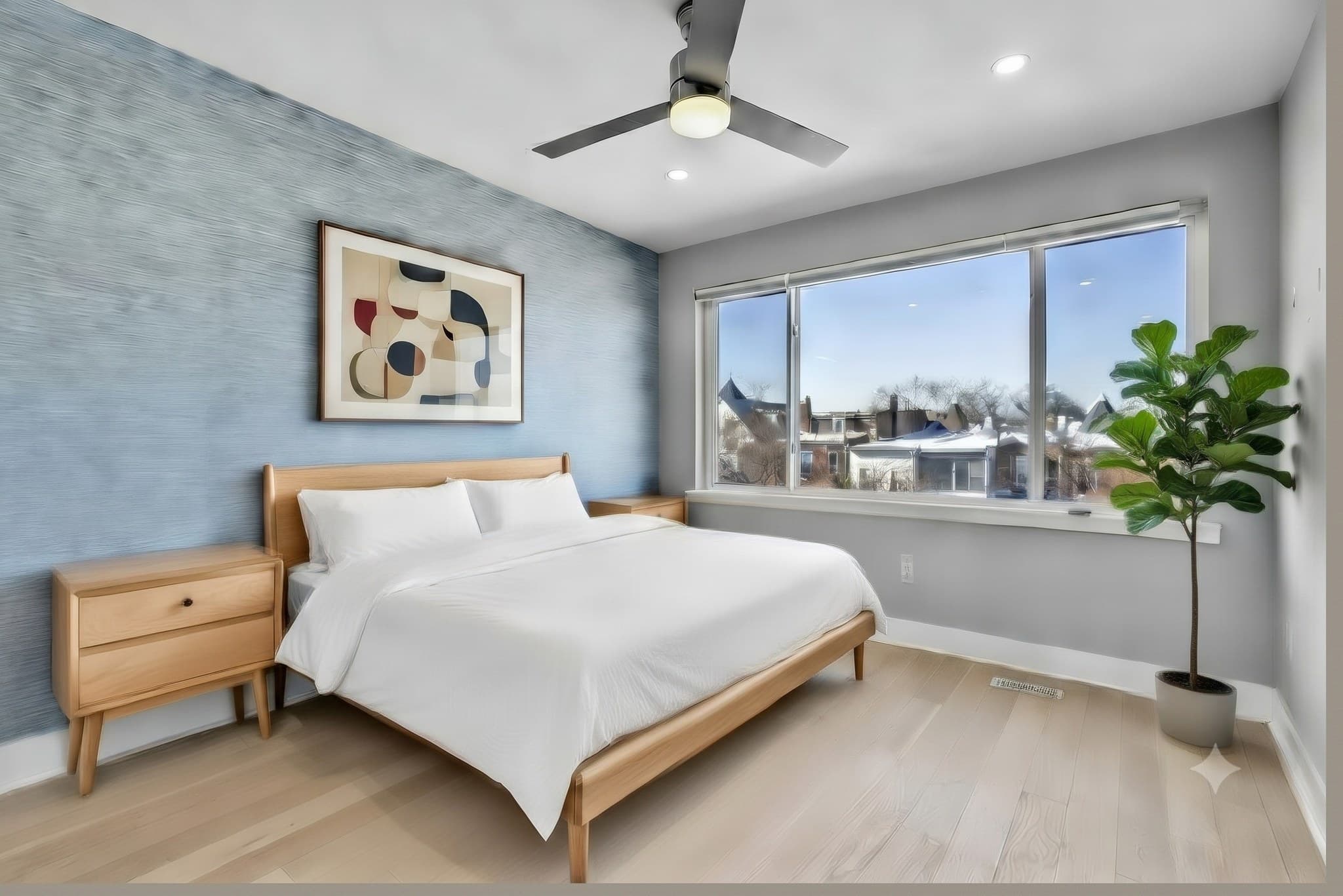 Rear-facing primary suite with grasscloth accent wall, virtually staged, at 3572 13th St NW #2
