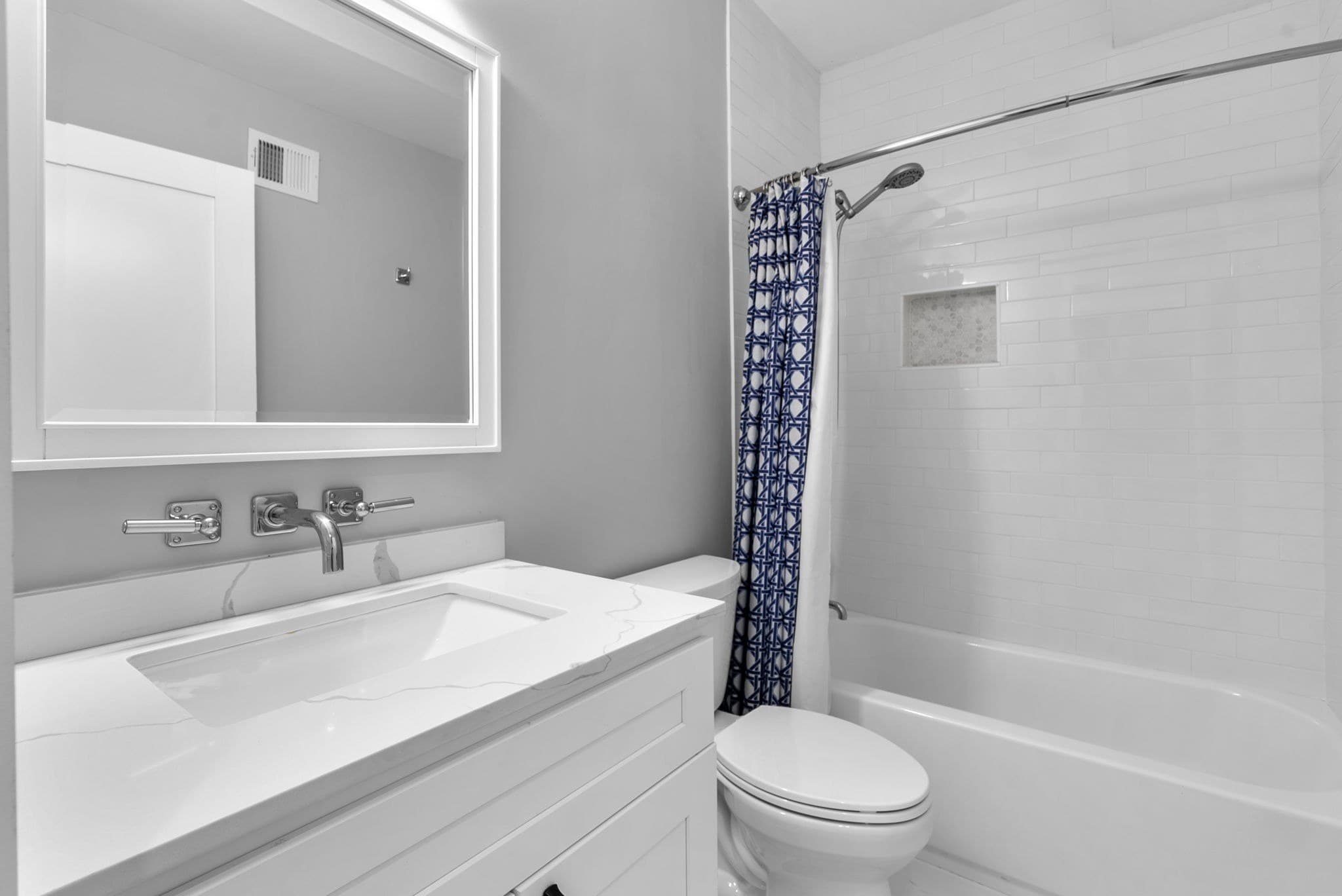 Hall bathroom with tub and shower at 3572 13th St NW #2
