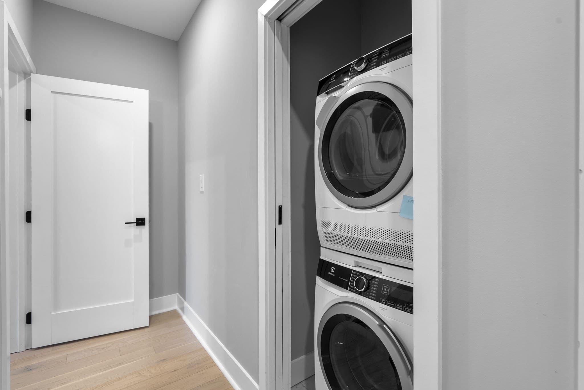 Stacked washer and dryer on the bedroom level at 3572 13th St NW #2