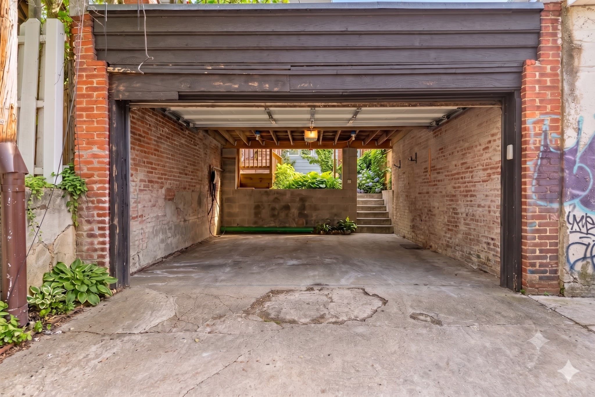 Private covered off-street parking accessed from the rear alley at 3572 13th St NW #2