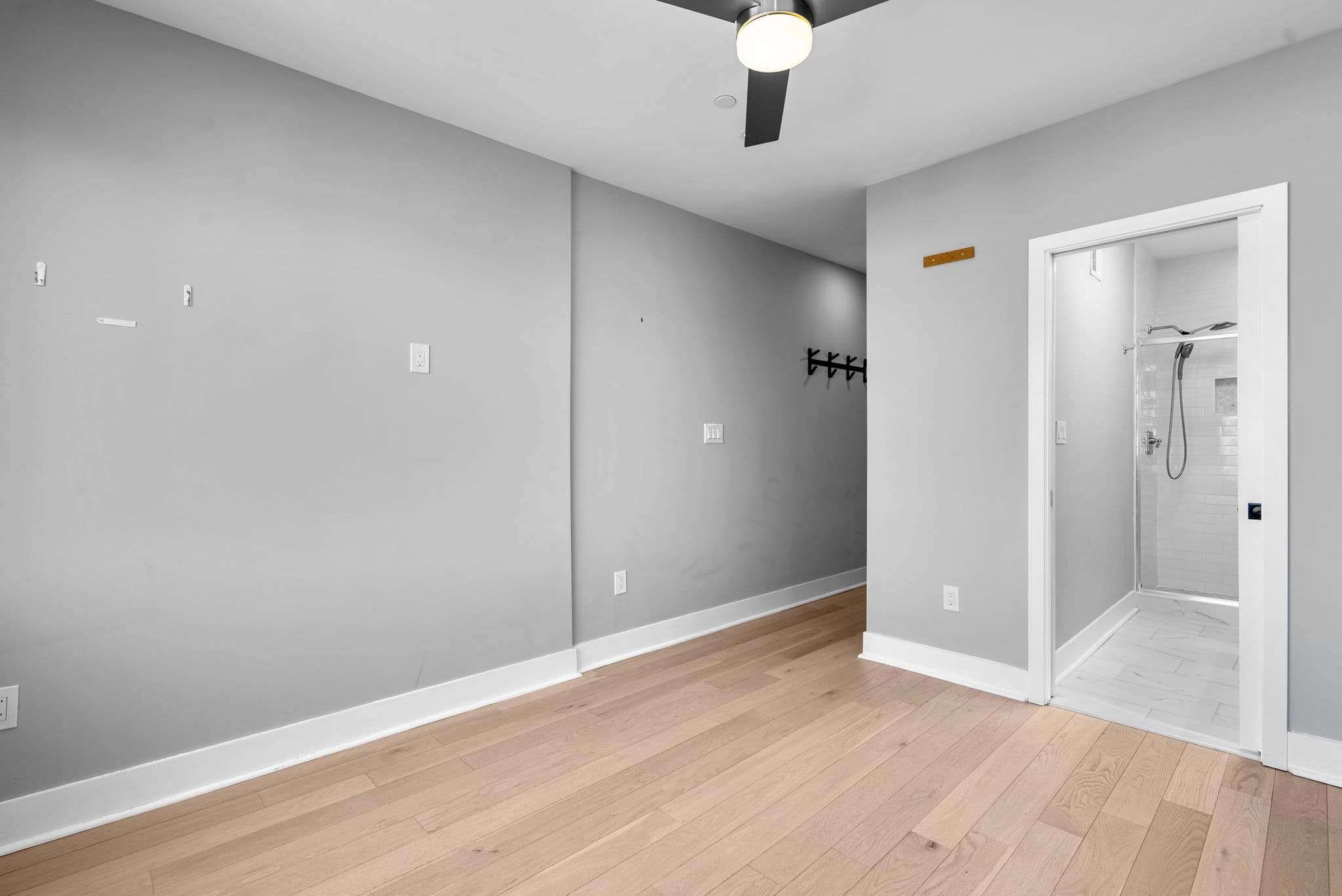 Primary suite with ceiling fan at 3572 13th St NW #2 condo