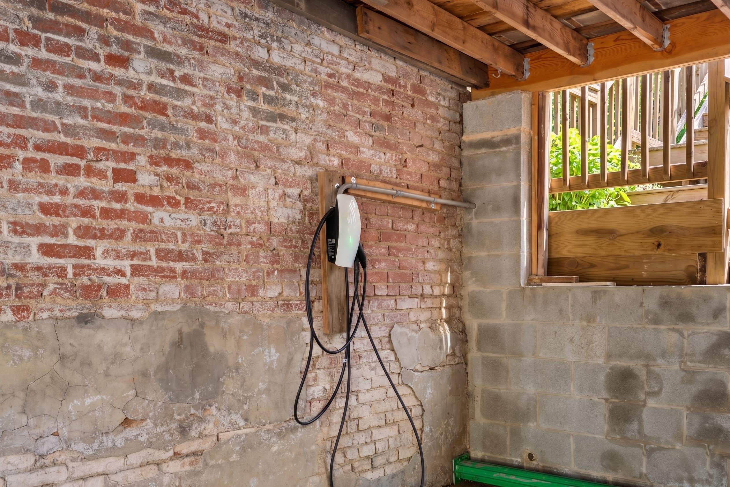 Tesla EV charger in private covered parking space at 3572 13th St NW #2